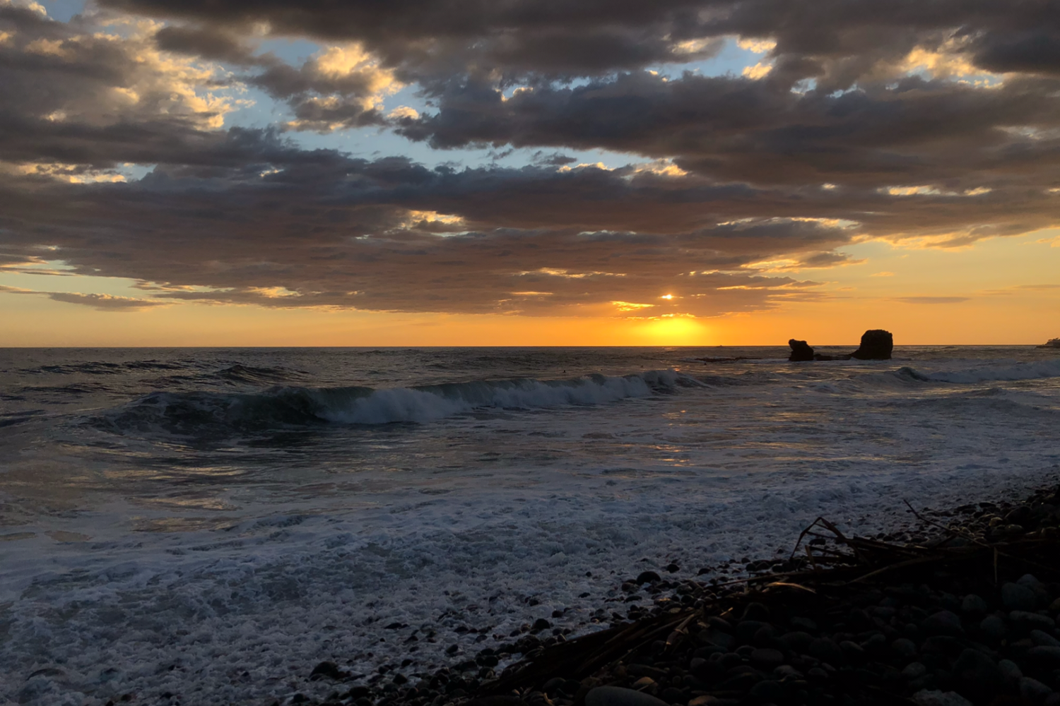 Sunset over El Tunco beach, a popular surf spot