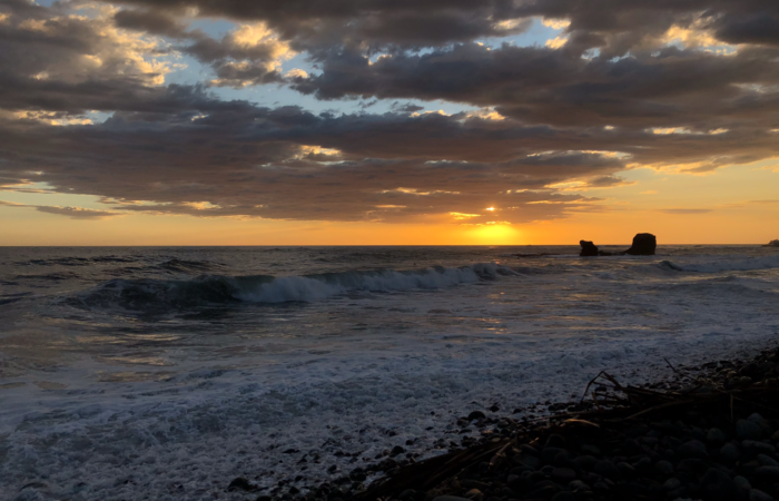 Sunset over El Tunco beach, a popular surf spot
