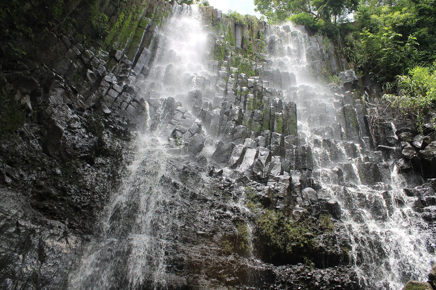 Los Tercios waterfall flowing over basalt columns near Suchitoto Los Tercios waterfall flowing over basalt columns near Suchitoto
